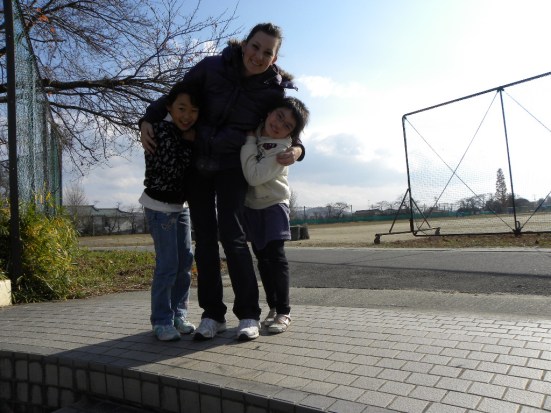 Me with some elementary students. These girls used to knock on my door every Saturday morning and ask me to come play.